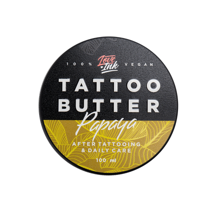 Top view of a 100ml jar of Tattoo Butter Papaya by LoveInk. The sleek black and yellow packaging highlights its purpose for after tattooing and daily care.